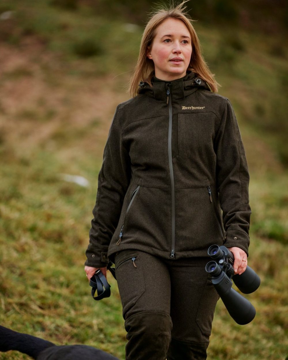 Loden Wood Deerhunter Lady Tatra Trousers on forest background #colour_loden-wood