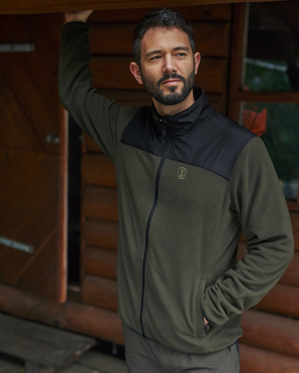 Rifle Green coloured Deerhunter Northward Fleece Jacket on Forest background #colour_rifle-green