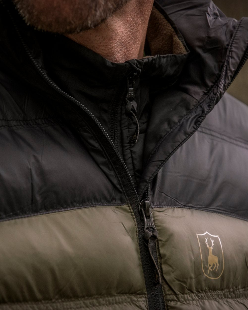 Rifle Green coloured Deerhunter Northward Padded Waistcoat on Forest background #colour_rifle-green