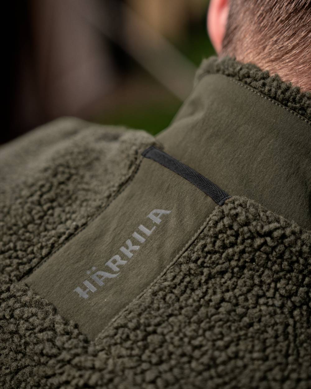 Rosin Coloured Harkila Fjell Polar Waistcoat on outdoor background #colour_rosin