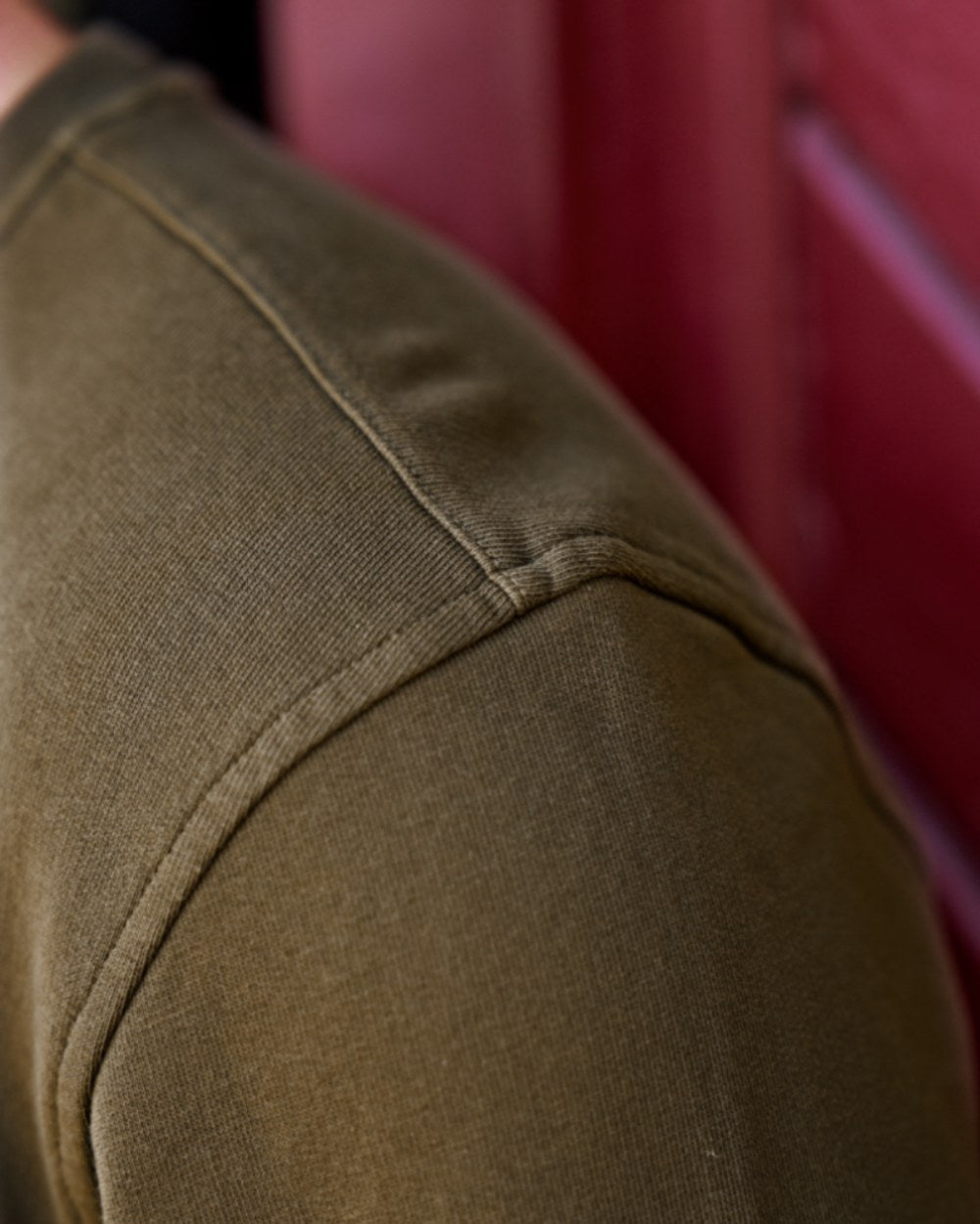 Light Willow Green Coloured Harkila Instinct Sweatshirt on blurry background #colour_light-willow-green