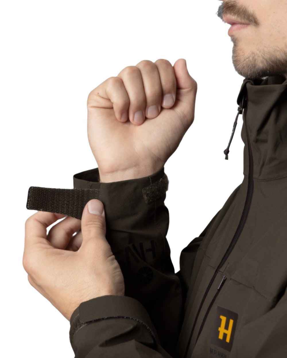 Willow Green Coloured Harkila Logmar HWS Packable Jacket on white background #colour_willow-green