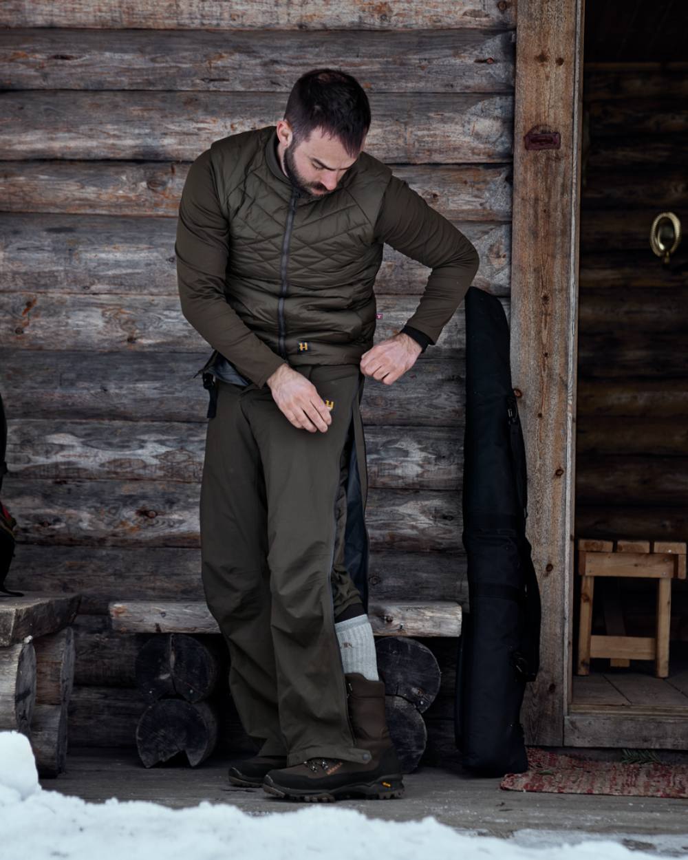 Willow Green Coloured Harkila Logmar Insulated Packable Knee Breeches on outdoor background #colour_willow-green