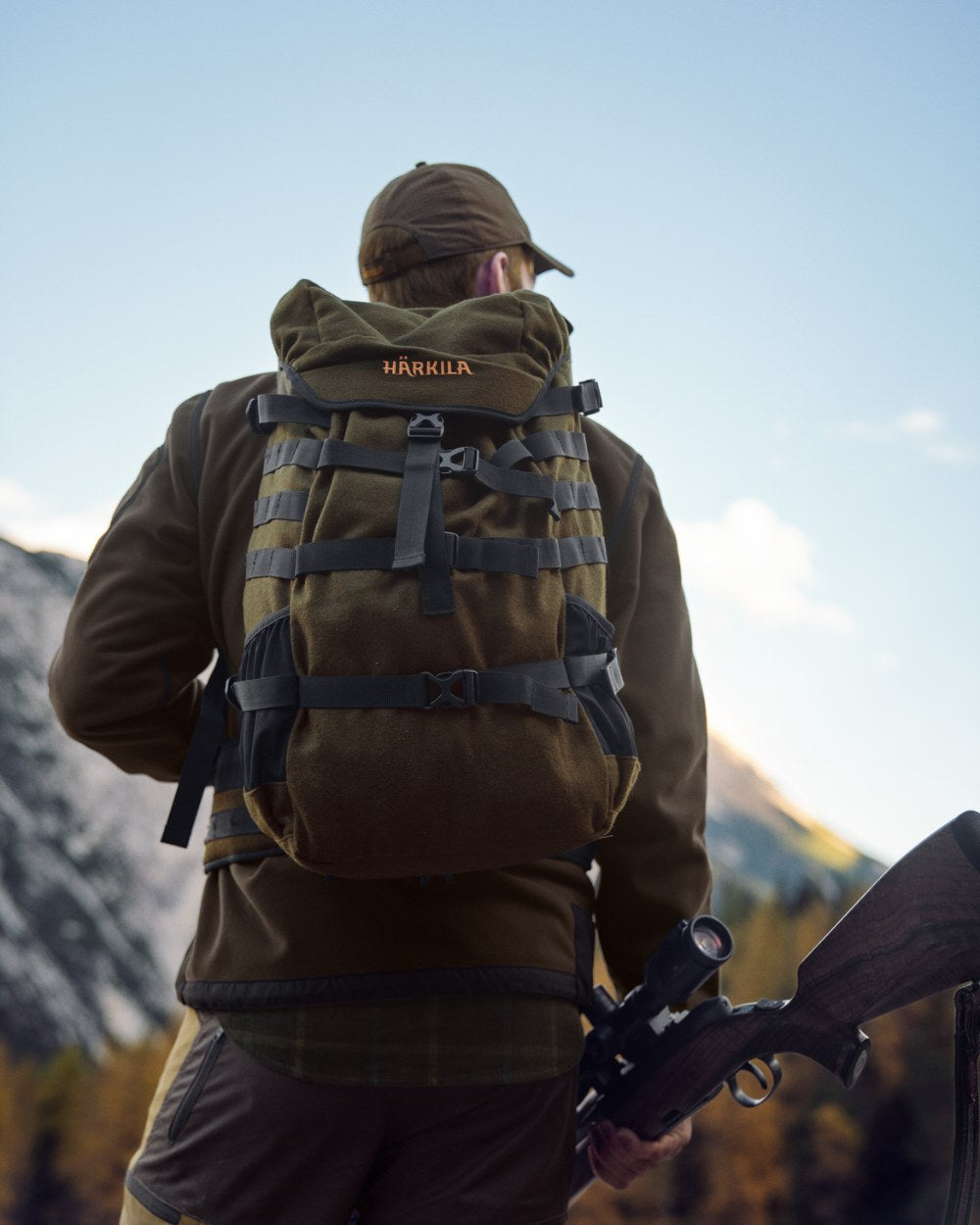 Willow Green Coloured Harkila Metso 2.0 Rucksack Backpack on mountain background #colour_willow-green