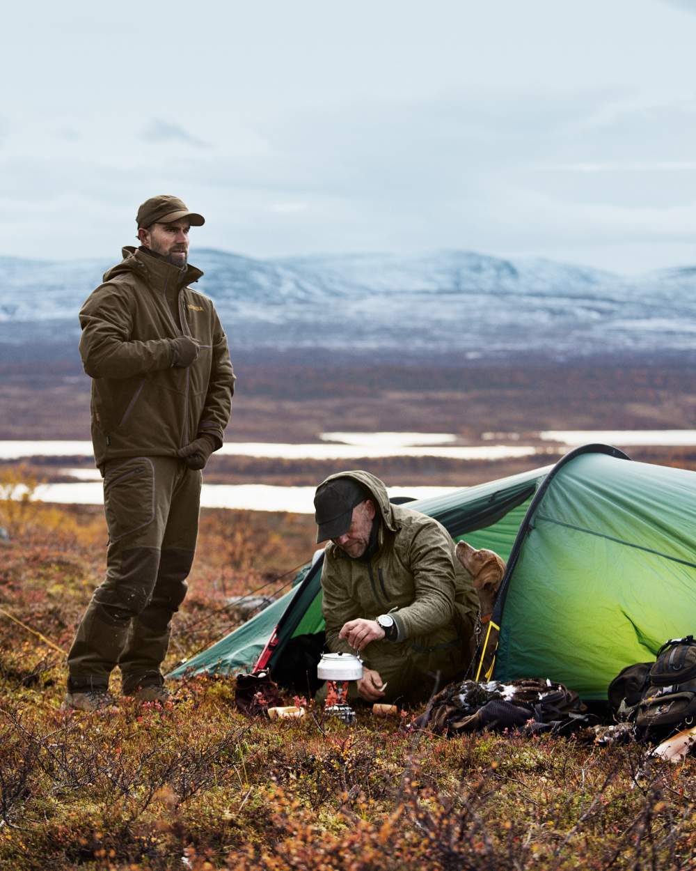Hunting Green Shadow Brown Coloured Harkila Mountain Hunter Jacket on outdoor background #colour_hunting-green-shadow-brown