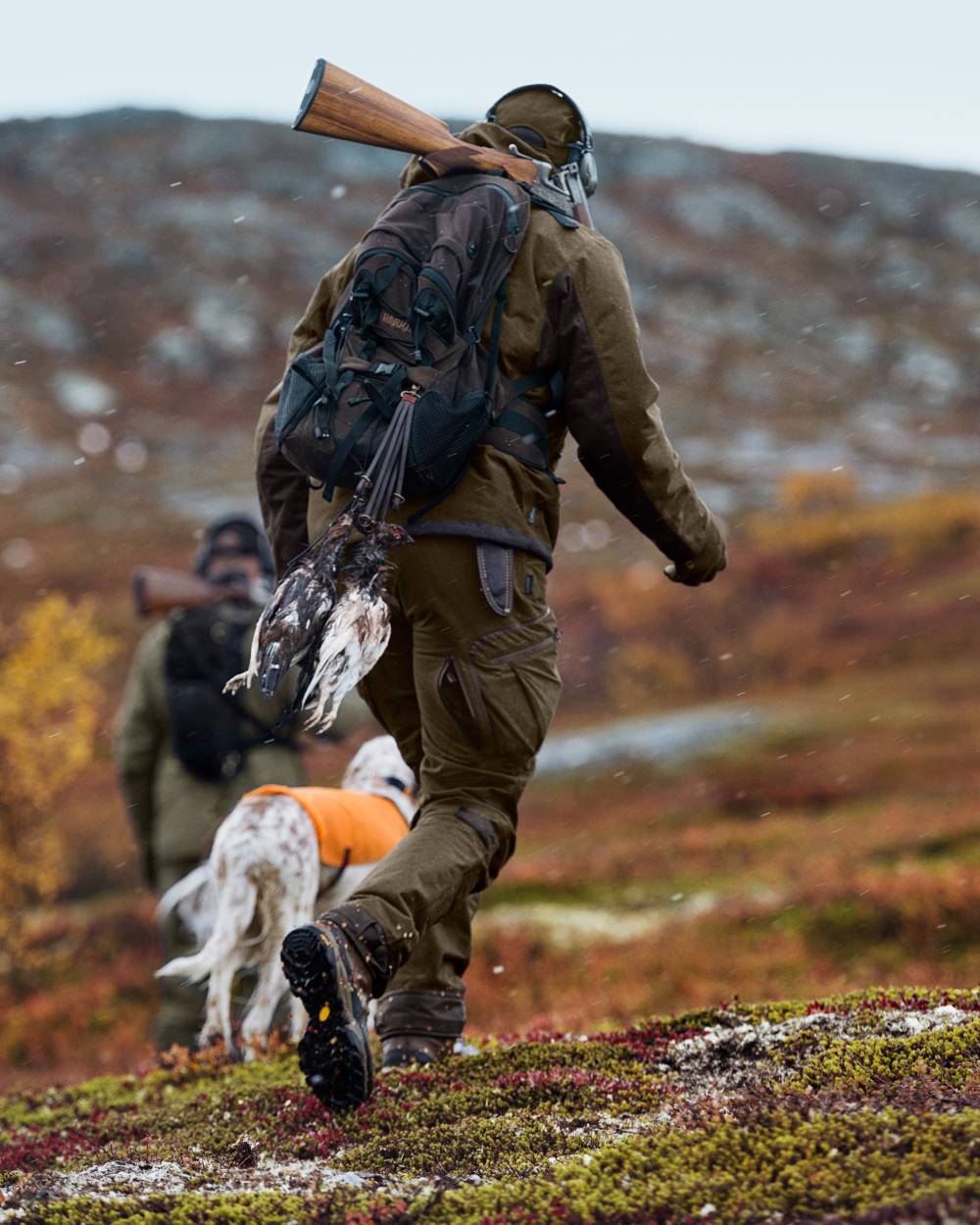 Hunting Green Shadow Brown Coloured Harkila Mountain Hunter Jacket on outdoor background #colour_hunting-green-shadow-brown
