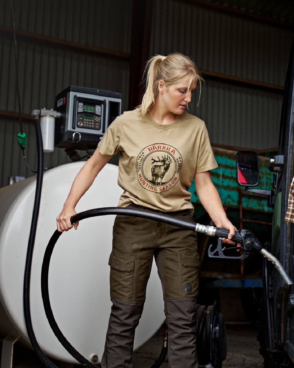 Sand Coloured Harkila Womens Stag Badge Short Sleeve T-Shirt on gas-station background #colour_sand
