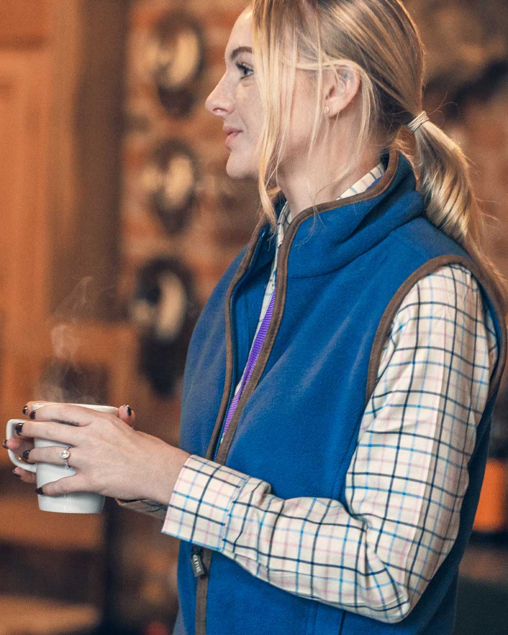 Denim coloured Jack Pyke Ladies Countryman Fleece Gilet on wooden wall background #colour_denim