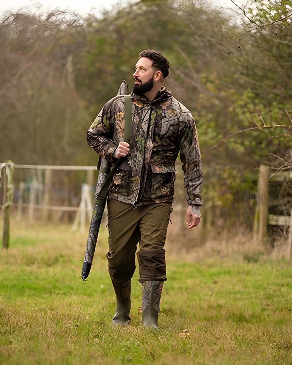 EVO coloured Jack Pyke Rannock Jacket on grassy background #colour_evo