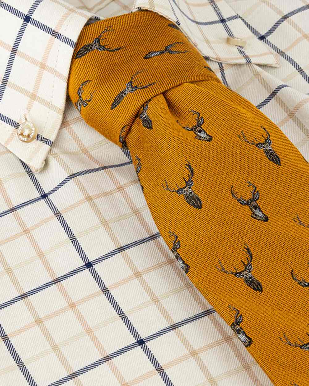 Mustard coloured Jack Pyke Silk Tie Stag on shirt background #colour_mustard