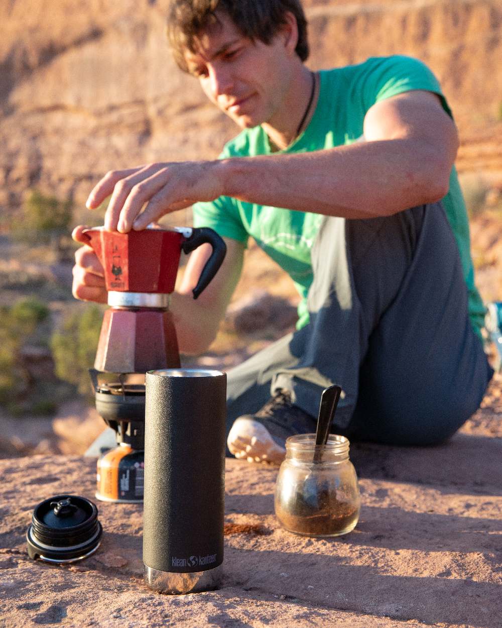Black Coloured Klean Kanteen Insulated TKWide With Cafe Cap On A Sand Background #colour_black
