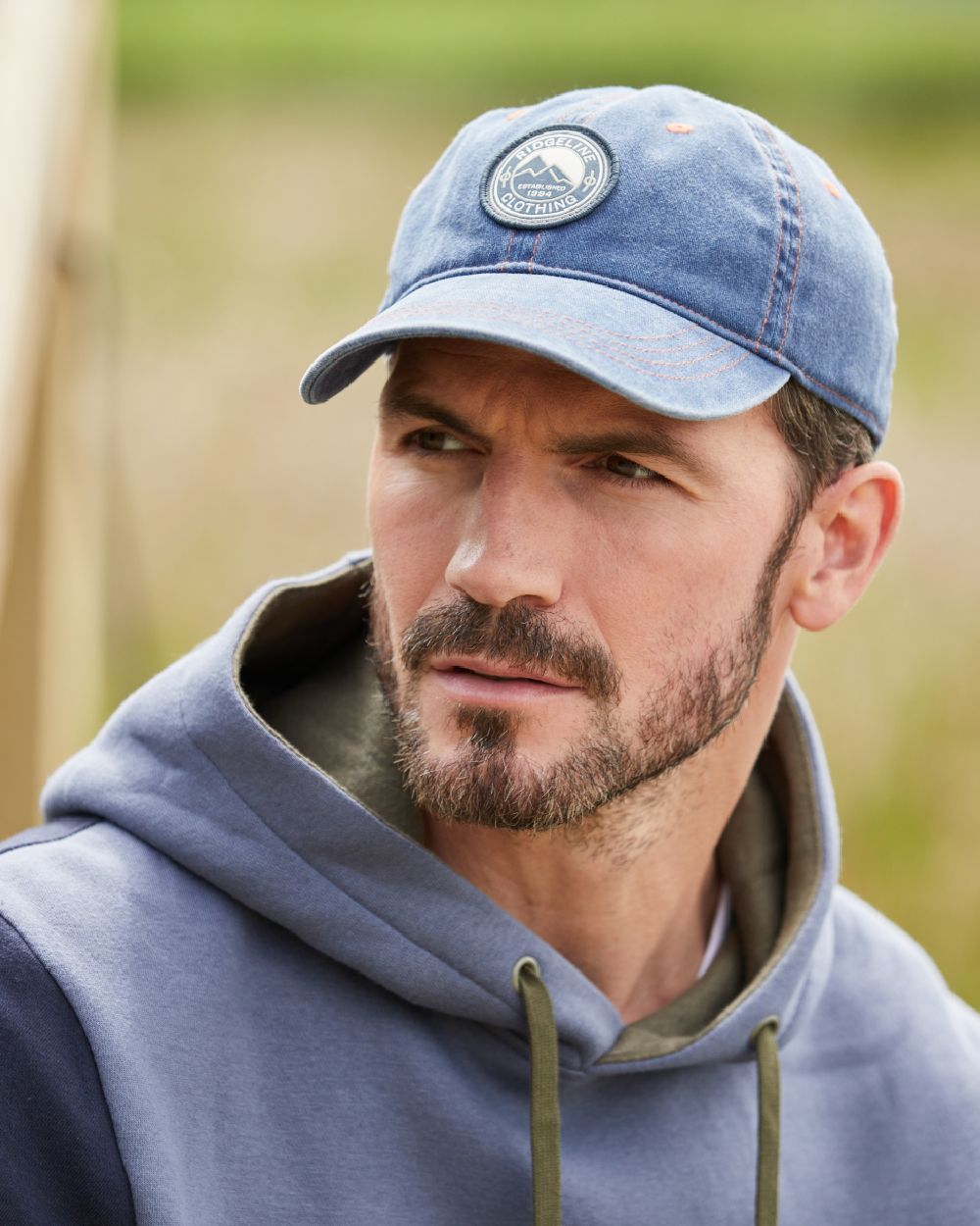 Denim Wash Coloured Ridgeline Original Truckie Cap On A Blurry Background #colour_denim-wash