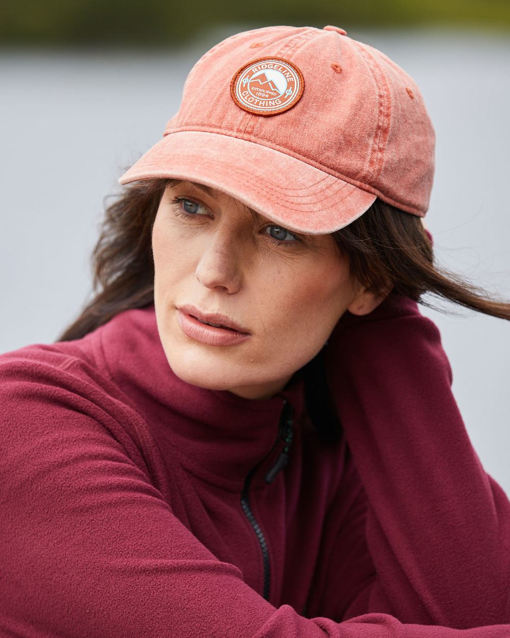 Russet Wash Coloured Ridgeline Original Truckie Cap On A Blurry Background #colour_russet-wash