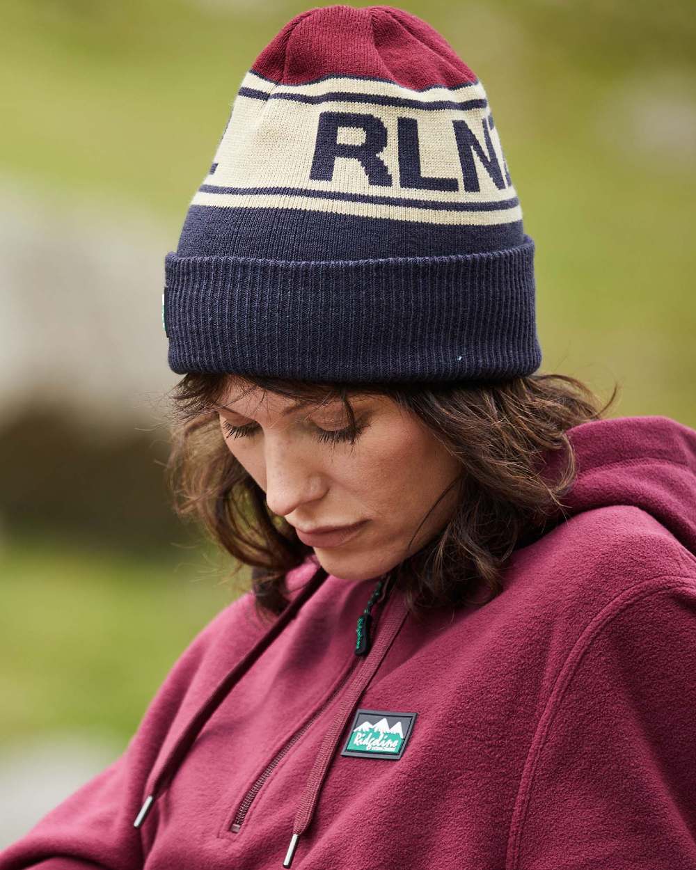 Navy Multi Coloured Ridgeline RLNZ Knitted Beanie On A Blurry Background #colour_navy-multi