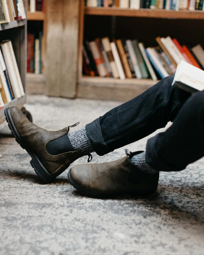 Dark Olive coloured Blundstone 1615 Classic Waxed Suede Chelsea Boots on library background #colour_dark-olive