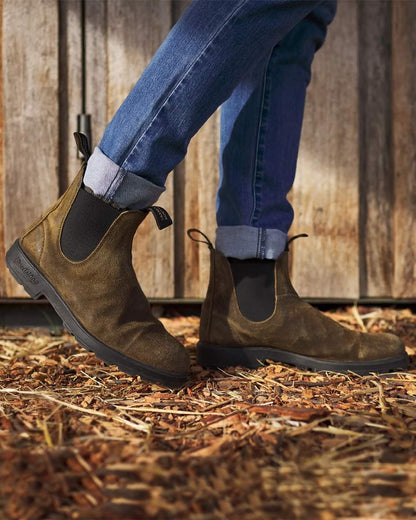Dark Olive coloured Blundstone 1615 Classic Waxed Suede Chelsea Boots on hay background #colour_dark-olive