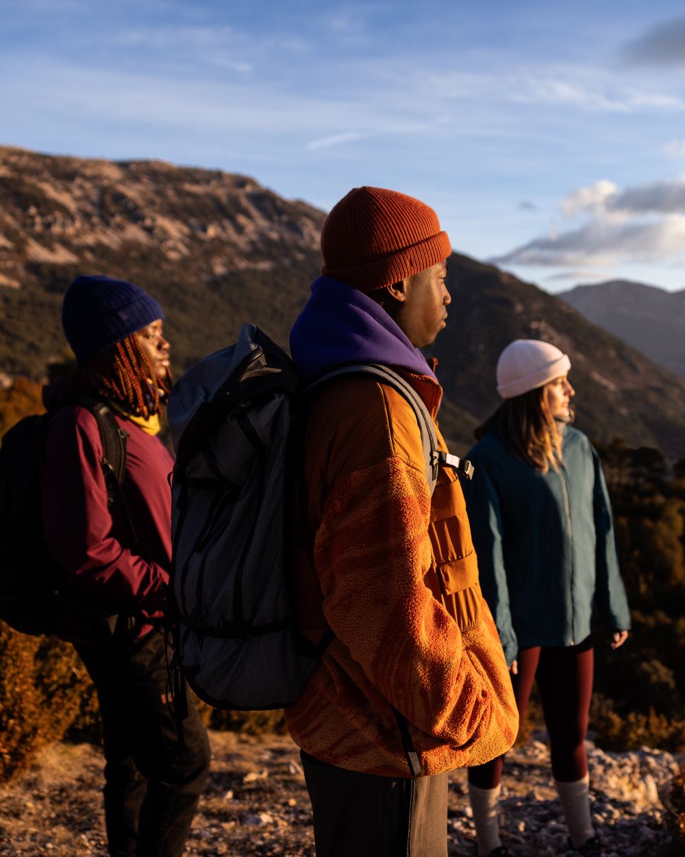 Cinnamon Coloured Buff Knitted Ervin Beanie on mountain background #colour_cinnamon