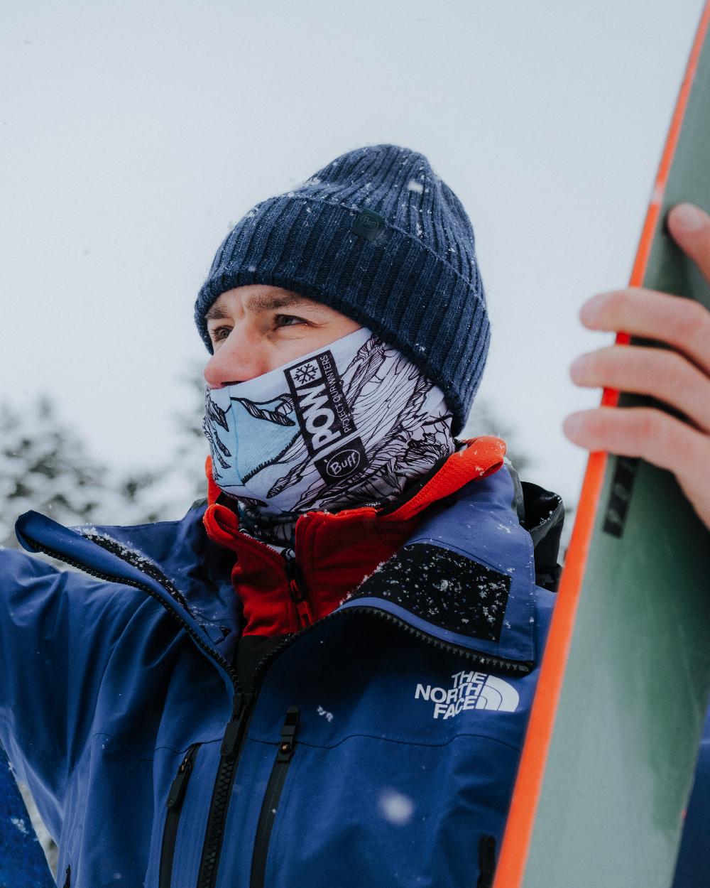 Midnight Coloured Buff Rutger Knitted Beanie on snow background #colour_midnight