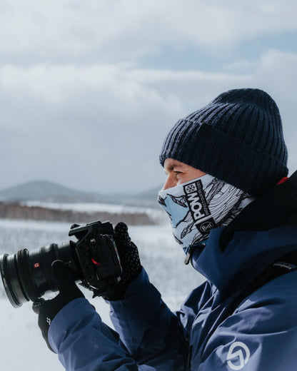 Midnight Coloured Buff Rutger Knitted Beanie on snow background #colour_midnight