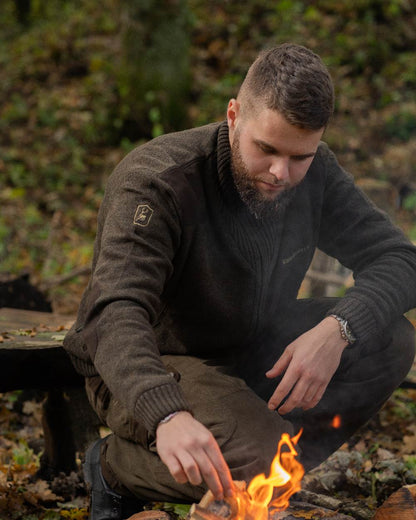 Dark Elm Melange coloured Deerhunter Carlisle Knit Cardigan With Stormliner on forest background #colour_dark-elm