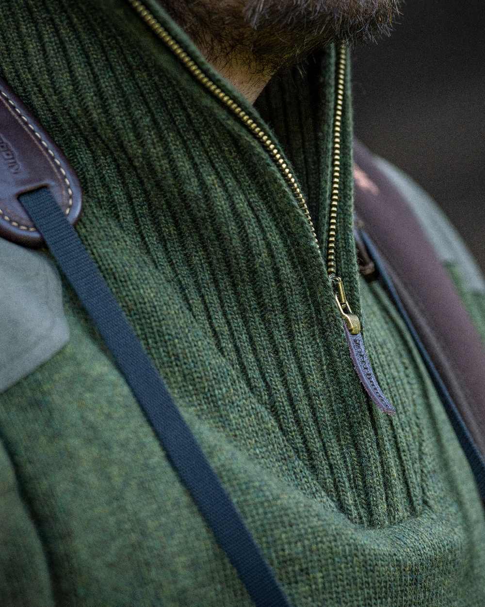 Green Melange coloured Deerhunter Carlisle Knit with Stormliner Zip Neck Sweater on blurry background #colour_green-melange