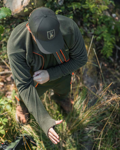 Forest Green coloured Deerhunter Chamois Full Zip Fleece Jacket on forest background #colour_forest-green