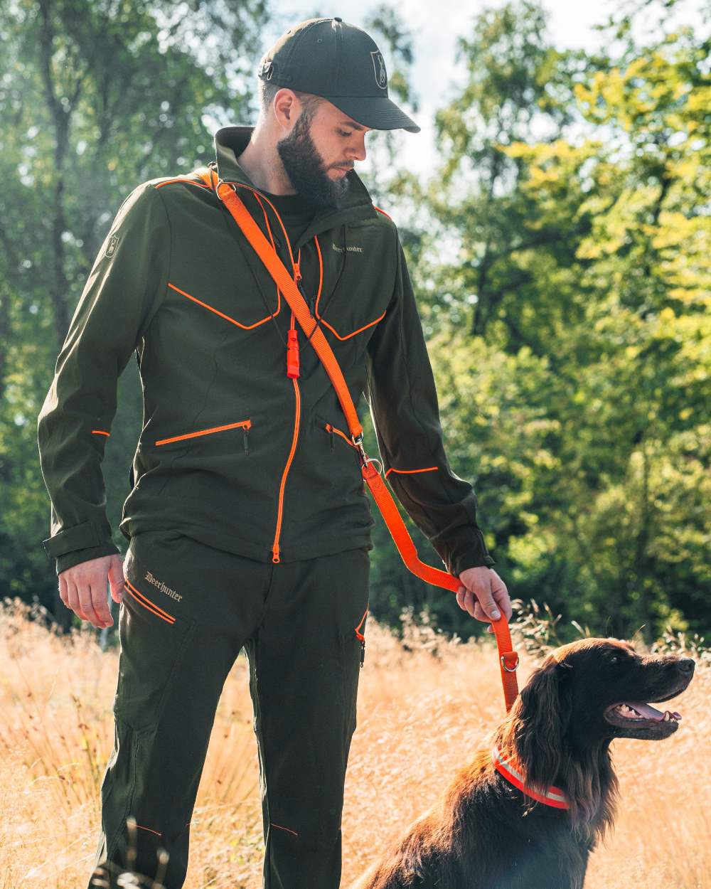 Forest Green coloured Deerhunter Chamois Jacket on forest background #colour_forest-green