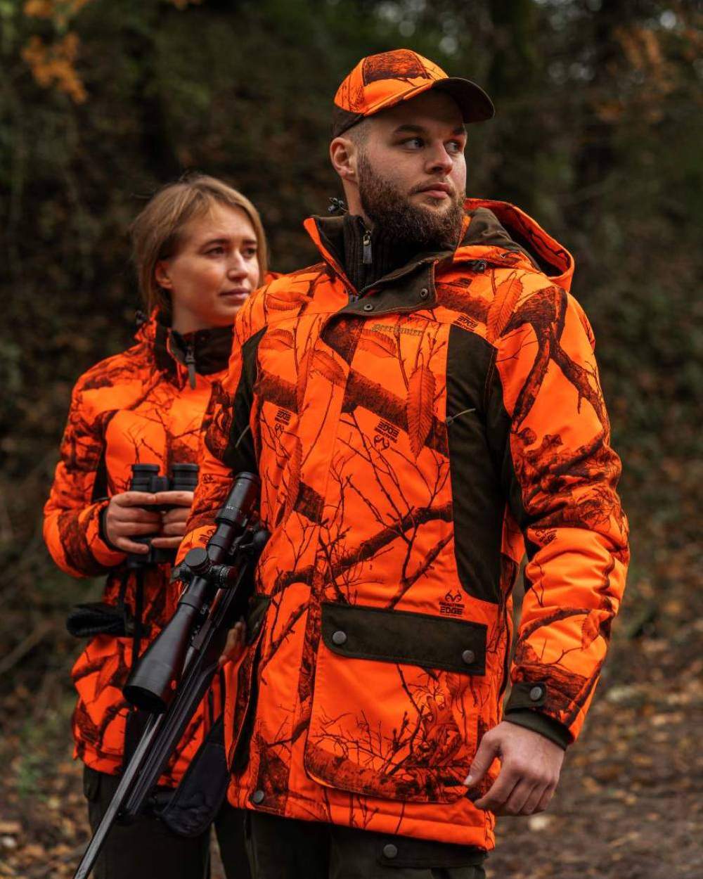 Realtree Edge Orange Coloured Deerhunter Eagle Winter Jacket On A Forest Background #colour_realtree-edge-orange