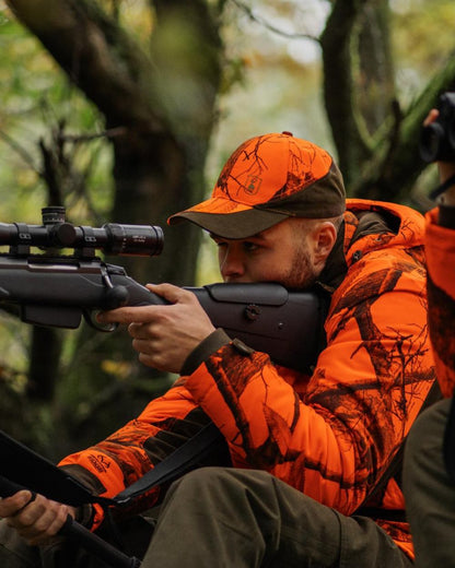 Realtree Edge Orange Coloured Deerhunter Eagle Winter Jacket On A Forest Background #colour_realtree-edge-orange