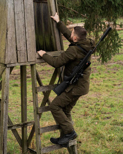 Tarmac Green Coloured Deerhunter Eagle Winter Jacket On A Forest Background #colour_tarmac-green