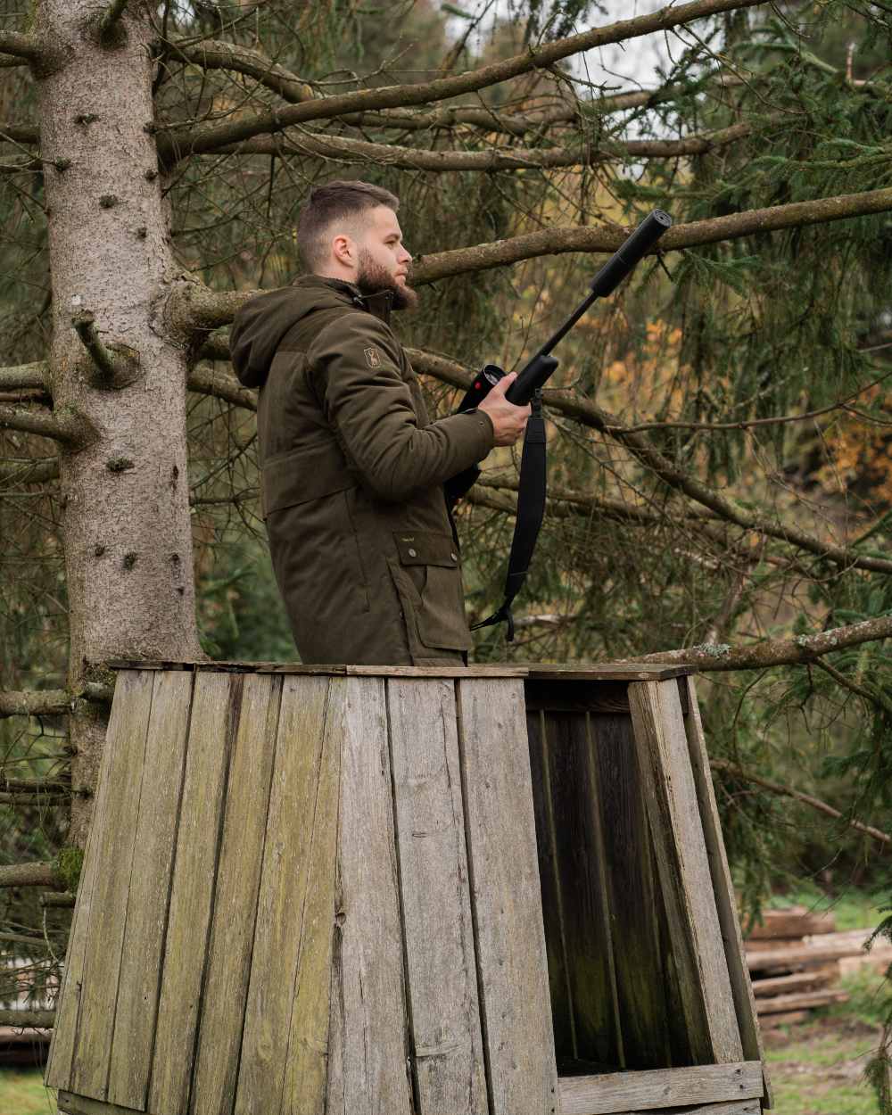 Tarmac Green Coloured Deerhunter Eagle Winter Jacket On A Forest Background #colour_tarmac-green