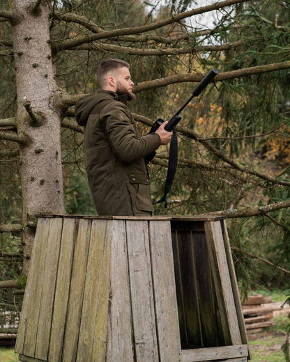 Tarmac Green Coloured Deerhunter Eagle Winter Jacket On A Forest Background #colour_tarmac-green