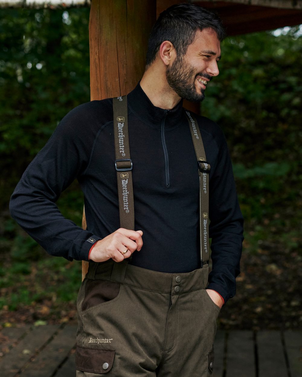 Tarmac Green Coloured Deerhunter Eagle Winter Trousers On A Forest Background #colour_tarmac-green