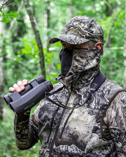 Realtree Excape coloured Deerhunter Excape Facemask on forest background #colour_realtree-excape