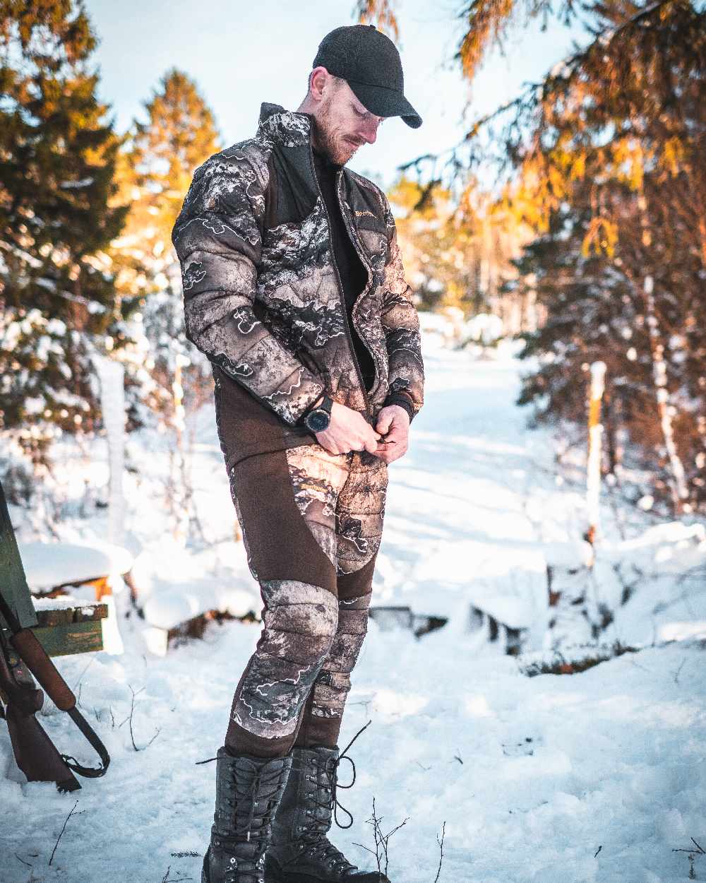 Realtree Excape coloured Deerhunter Excape Quilted Trousers on snow background #colour_realtree-excape