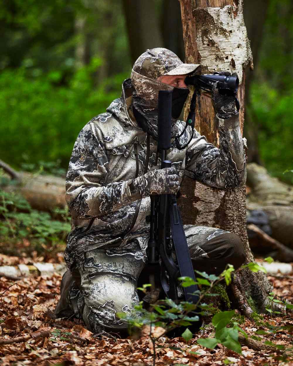 Realtree Excape coloured Deerhunter Excape Softshell Jacket on forest background #colour_realtree-excape