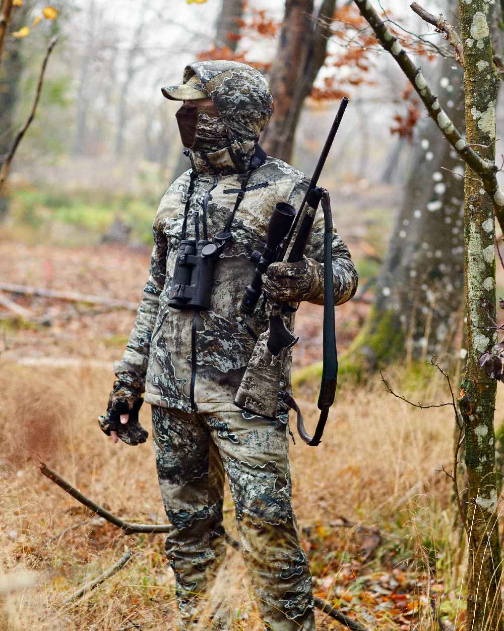 Realtree Excape coloured Deerhunter Excape Winter Waterproof Jacket on forest background #colour_realtree-excape