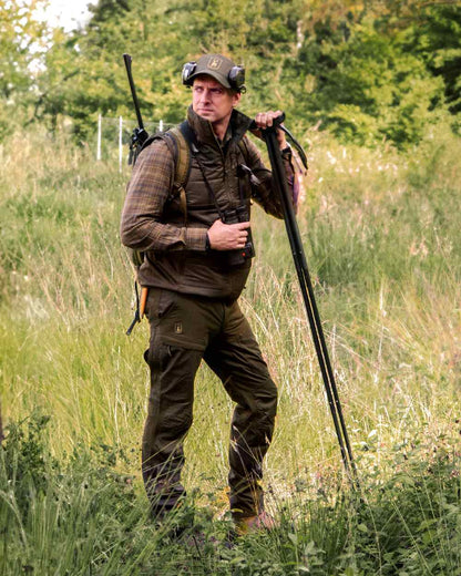Wood Coloured Deerhunter Heat Padded Waistcoat on forest background #colour_wood