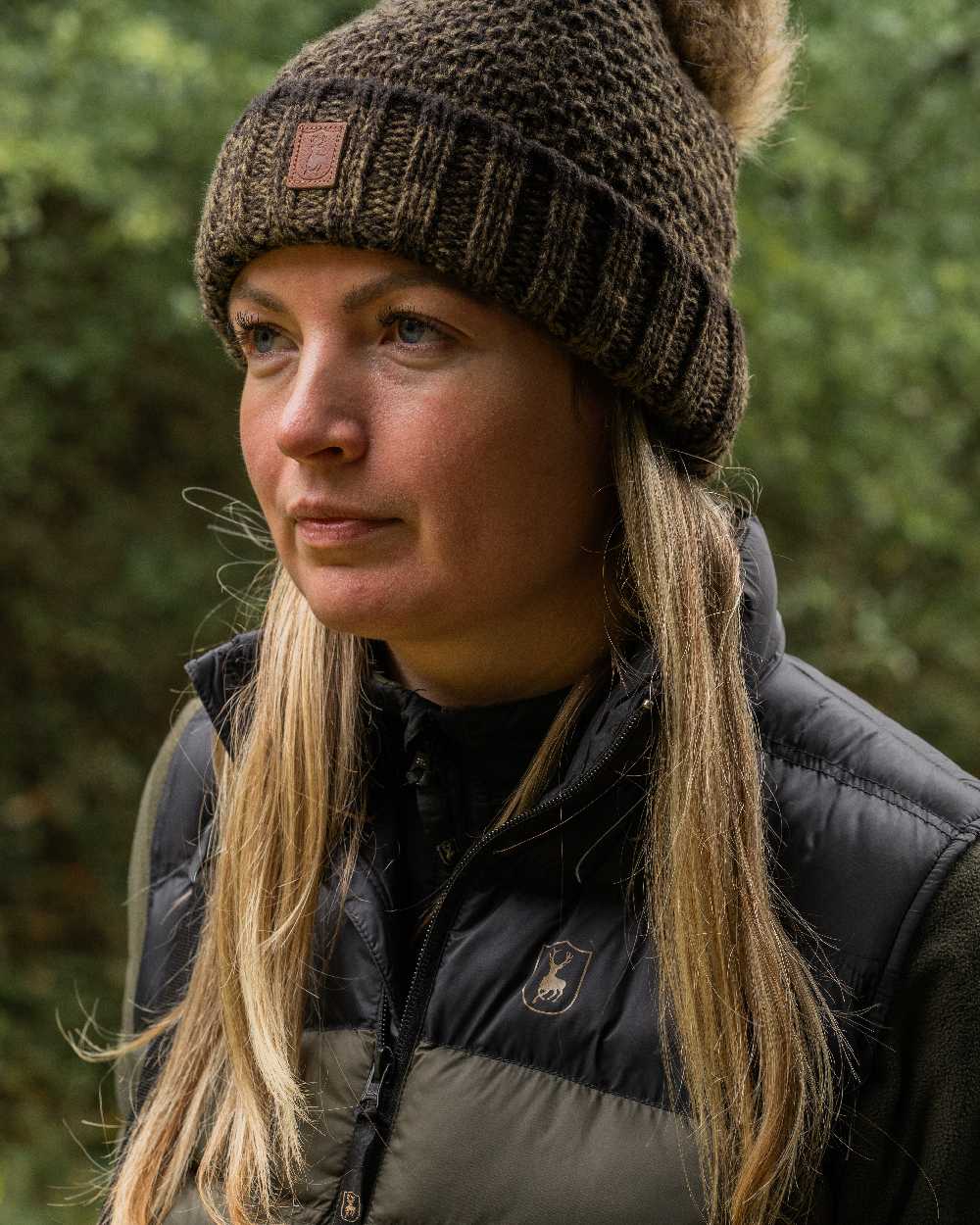 Art Green coloured Deerhunter Ladies Knitted Hat on blurry background #colour_art-green