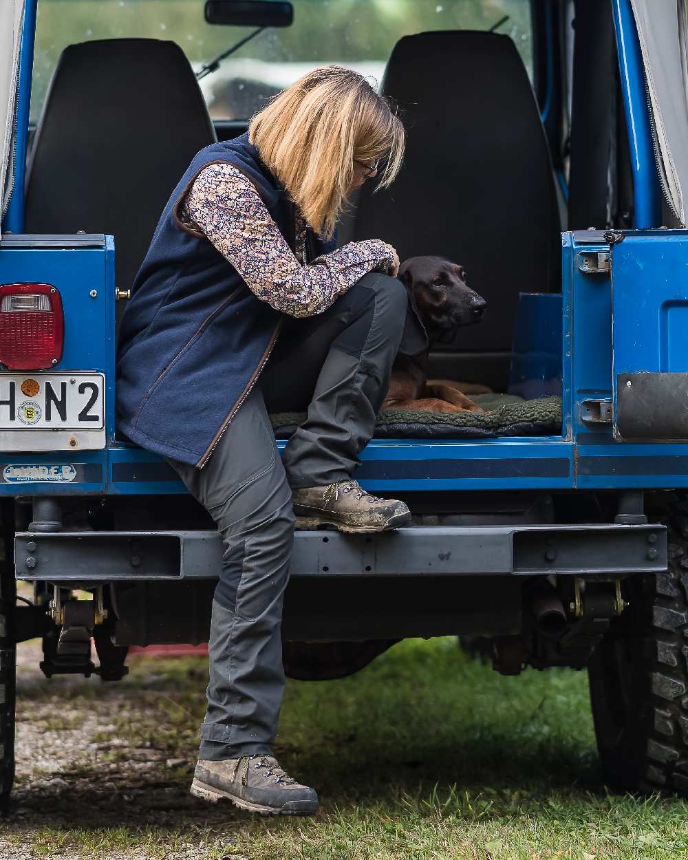 Black Ink coloured Deerhunter Lady Ann Trousers on jeep background #colour_black-ink