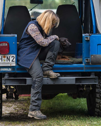 Black Ink coloured Deerhunter Lady Ann Trousers on jeep background #colour_black-ink