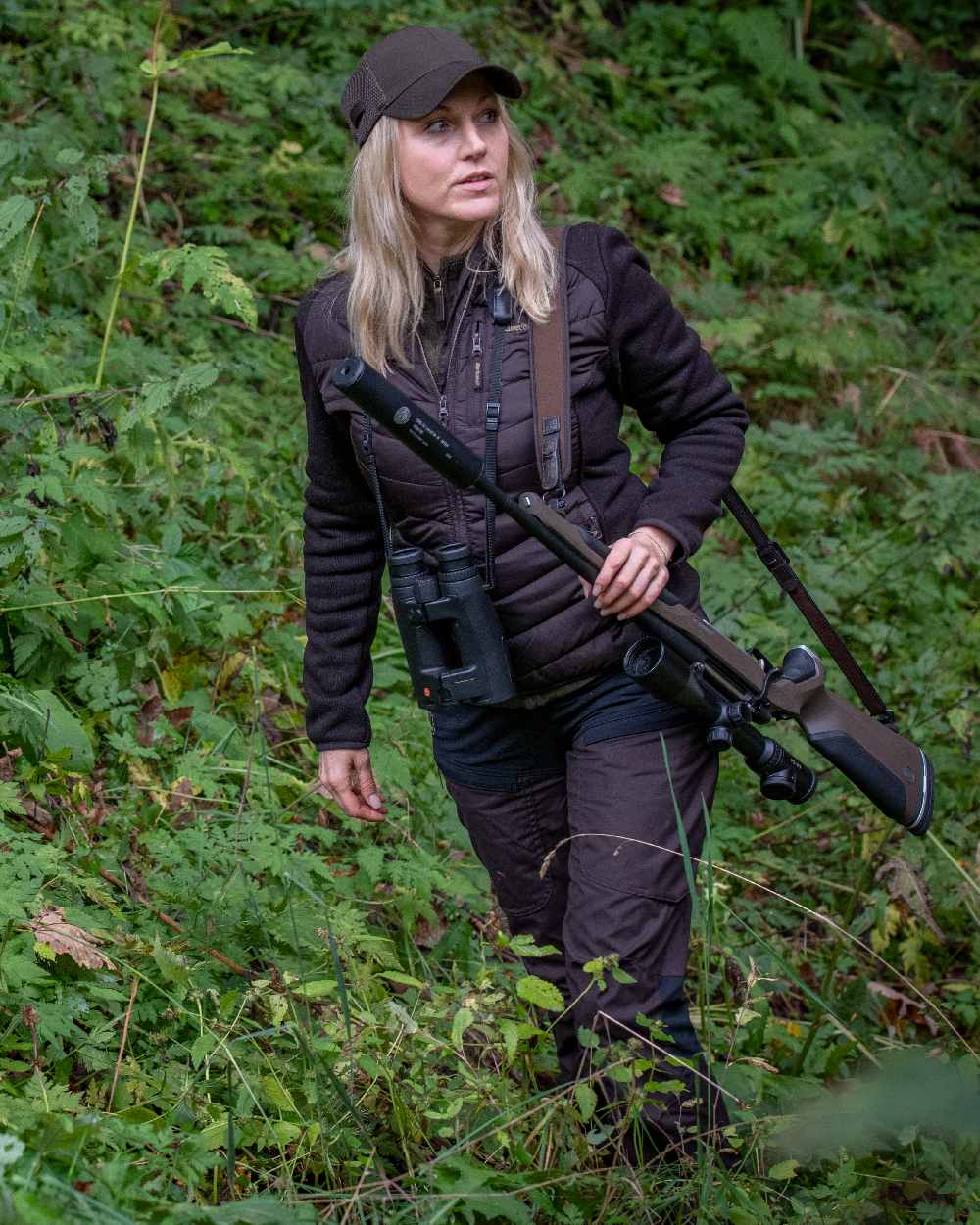 Dark Prune coloured Deerhunter Lady Ann Trousers on forest background #colour_dark-prune