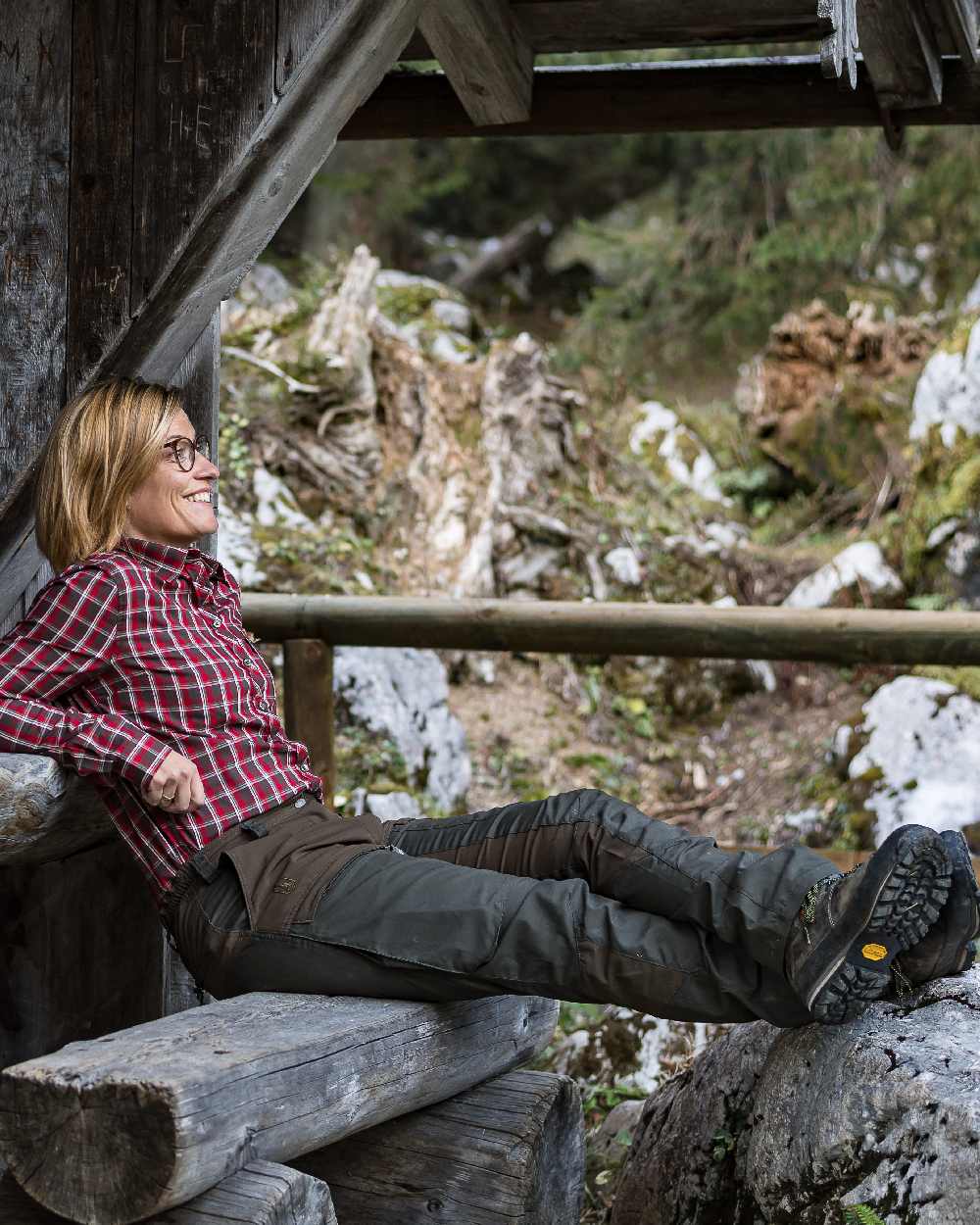 Deep Green coloured Deerhunter Lady Ann Trousers on forest background #colour_deep-green