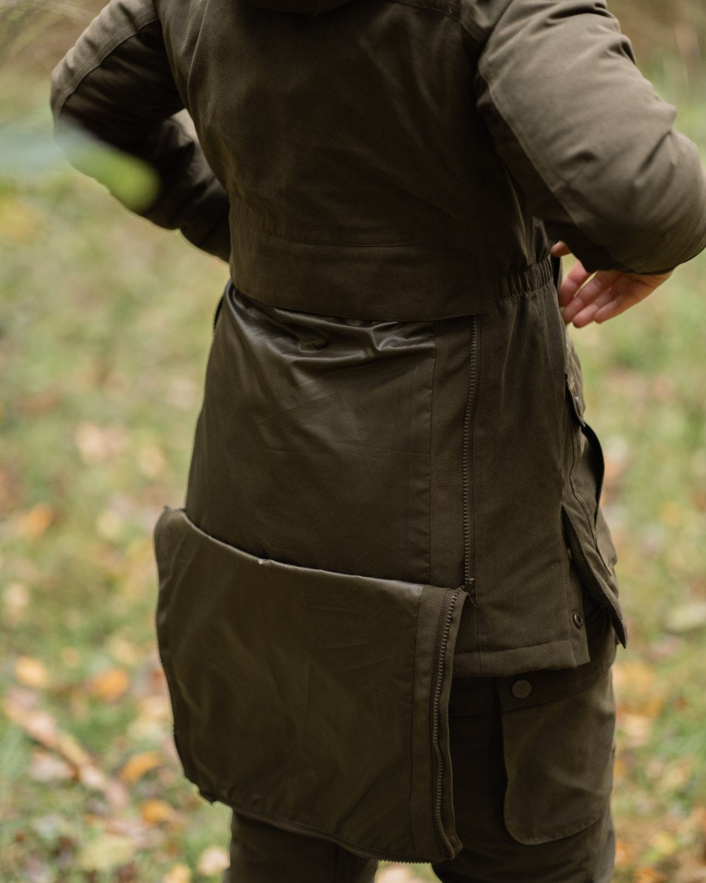 Tarmac Green coloured Deerhunter Lady Eagle Winter Jacket on blurry background #colour_tarmac-green