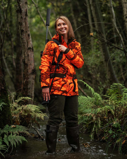 Tarmac Green coloured Deerhunter Lady Eagle Winter Trousers on forest background #colour_tarmac-green