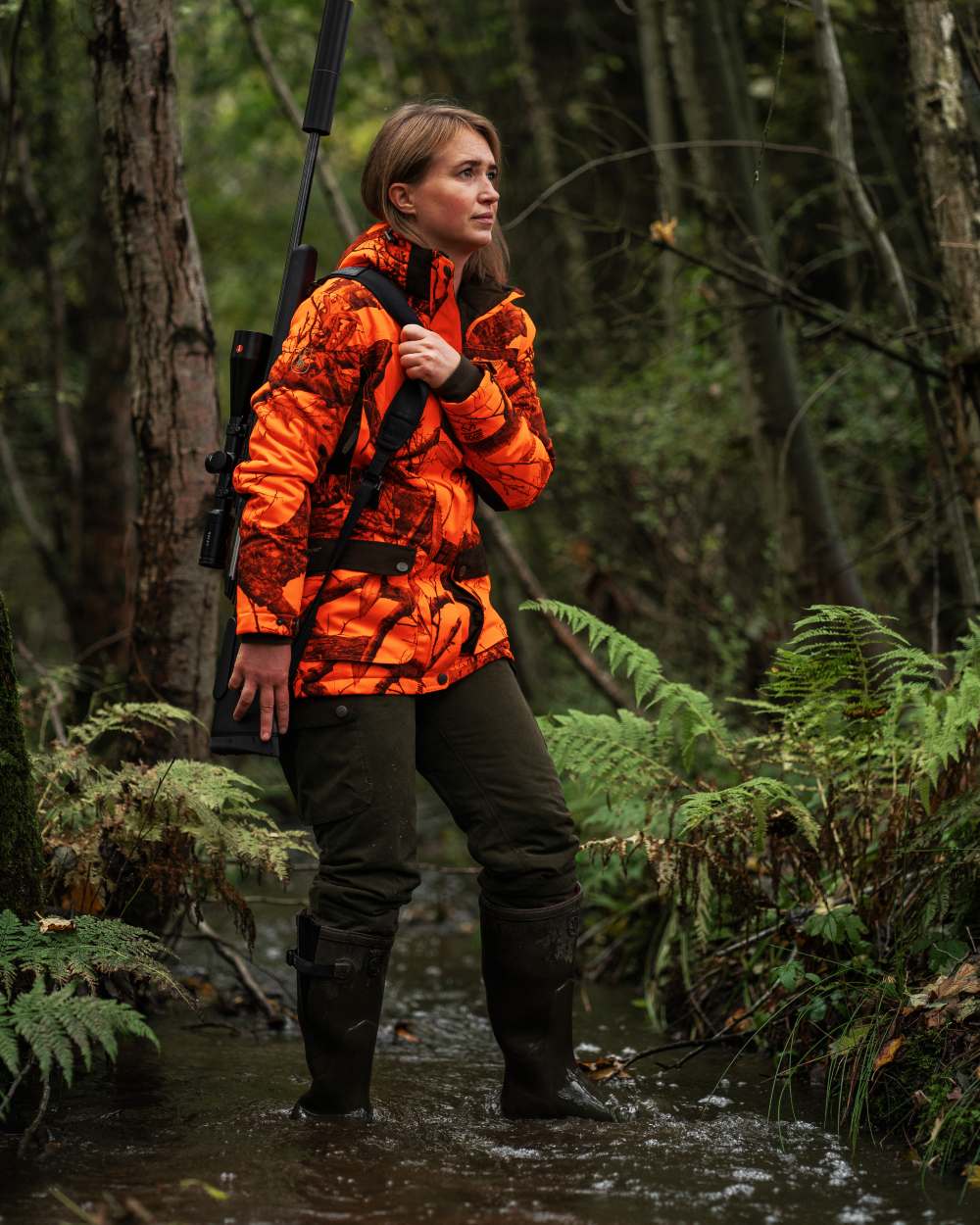 Tarmac Green coloured Deerhunter Lady Eagle Winter Trousers on forest background #colour_tarmac-green