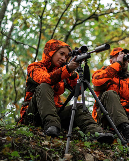 Tarmac Green coloured Deerhunter Lady Eagle Winter Trousers on forest background #colour_tarmac-green
