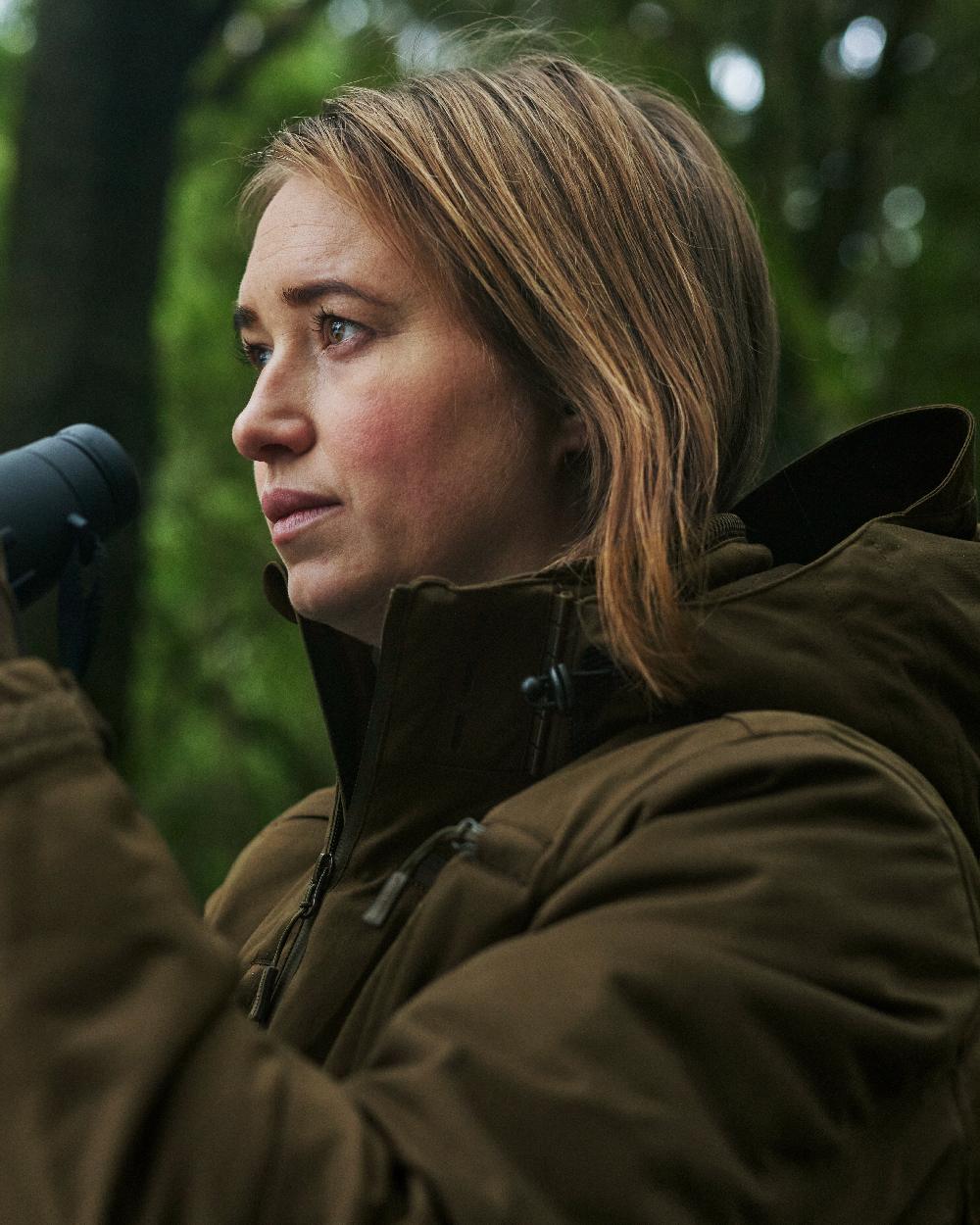Art Green coloured Deerhunter Lady Excape Winter Jacket on blurry background #colour_art-green