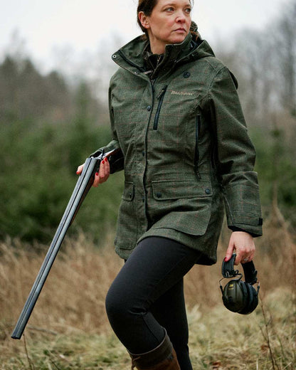 Black coloured Deerhunter Lady Hunting Tights on grassy background #colour_black