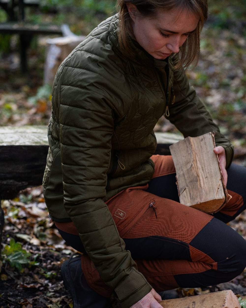Forest Green coloured Deerhunter Lady Mossdale Quilted Jacket on forest background #colour_forest-green